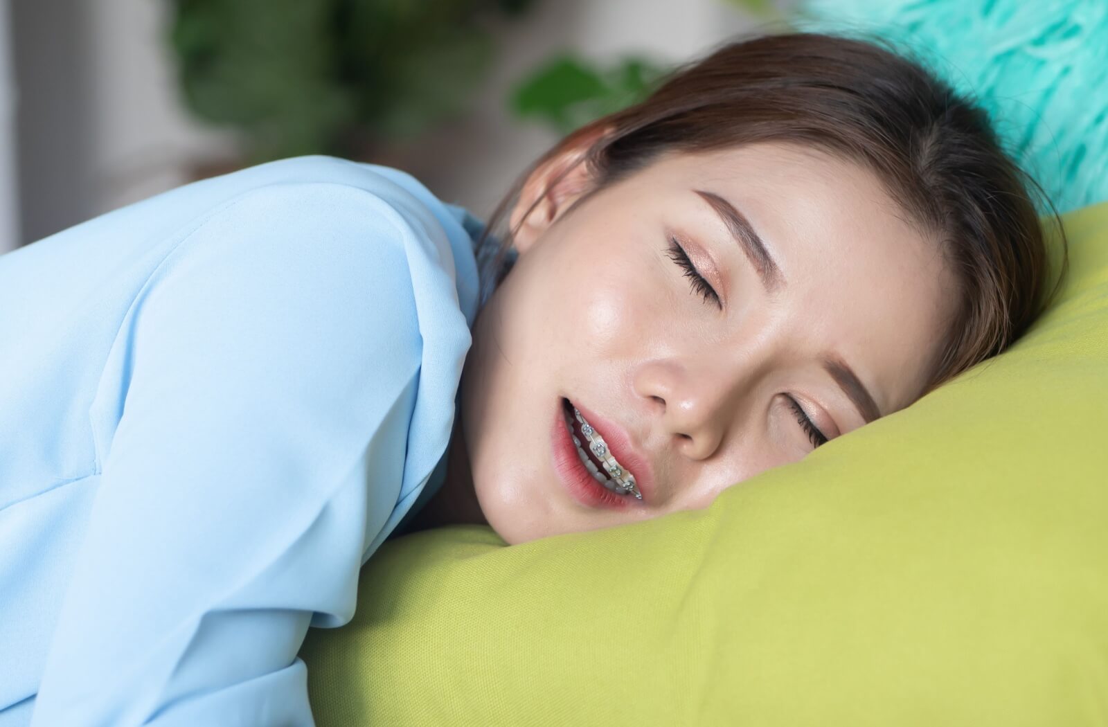 A person comfortably naps away the time their mouth is frozen.